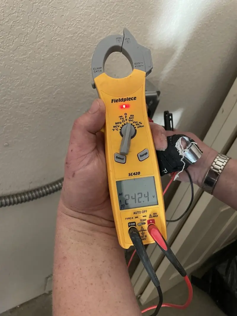 Voltage testing with clamp meter during Ceiling Fan Installation in South Ogden
